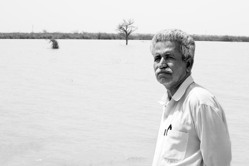 Khadin-A Nature-Based Solution for Water for Agriculture in Thar Desert, Jaisalmer district, Rajasthan - Chatar Singh explaining about water sold from Derasar Khadin